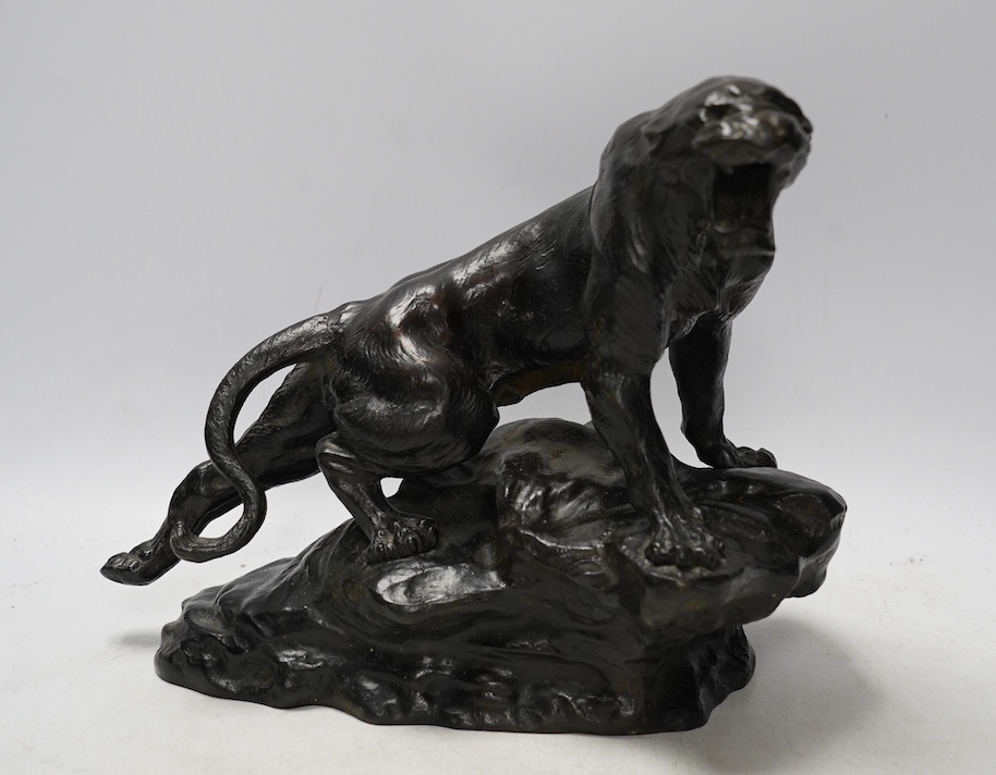 After Thomas Francois Cartier (1879-1943), bronze study of a roaring tiger, signed in the casting, 26cm wide. Condition - fair - tail has been detached and re-attached.